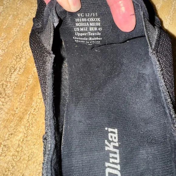 NWOT. Olukai Men's Black Slip-On Shoes