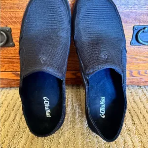 NWOT. Olukai Men's Black Slip-On Shoes