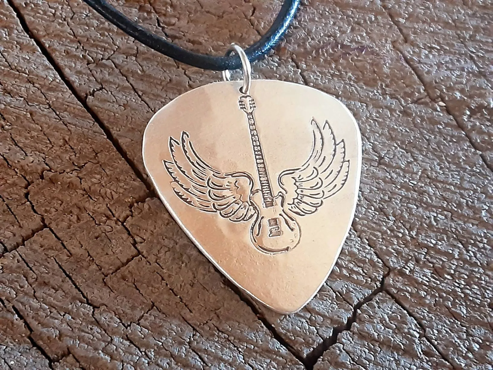 Sterling Silver winged guitar on guitar pick necklace