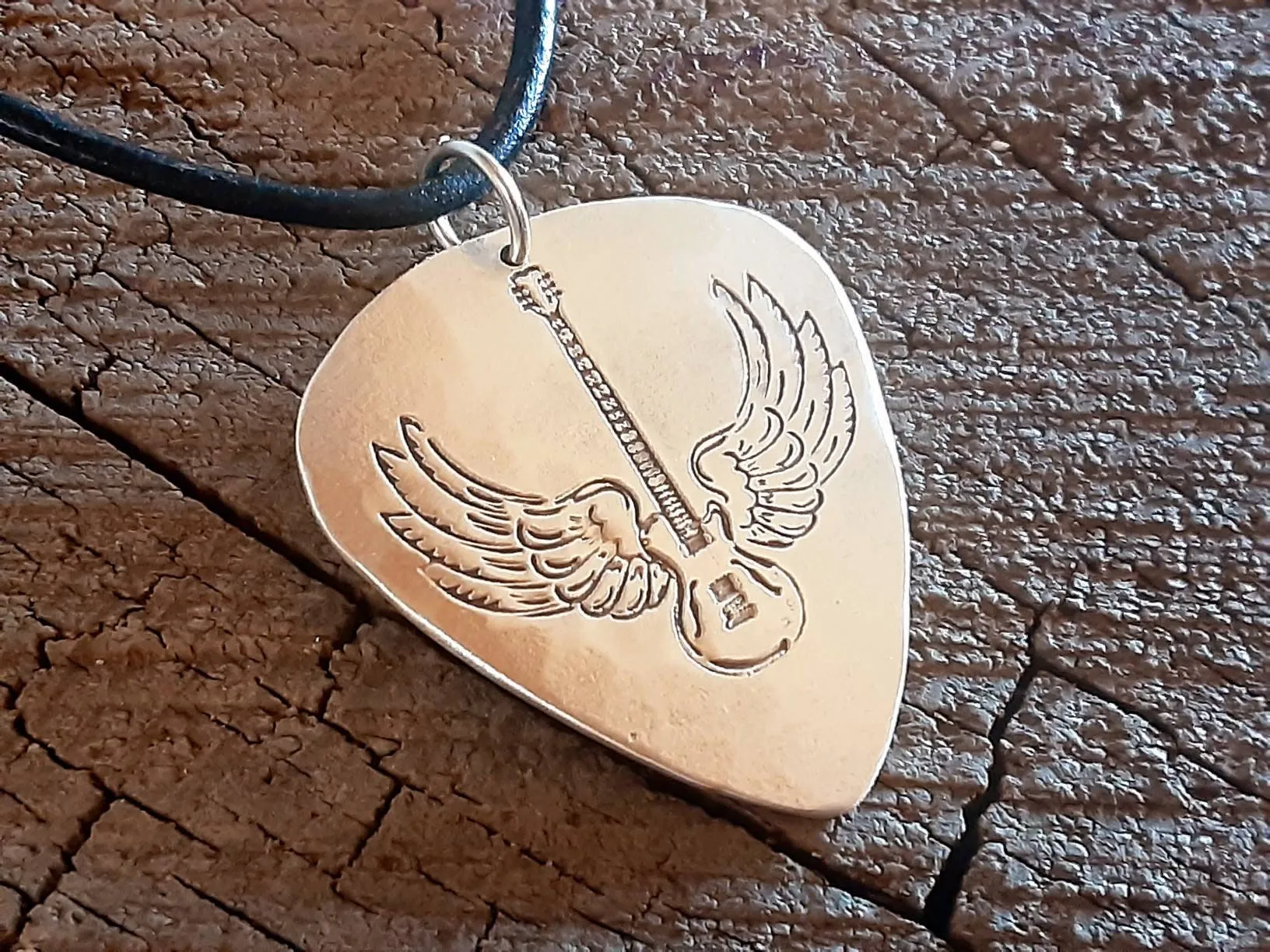 Sterling Silver winged guitar on guitar pick necklace
