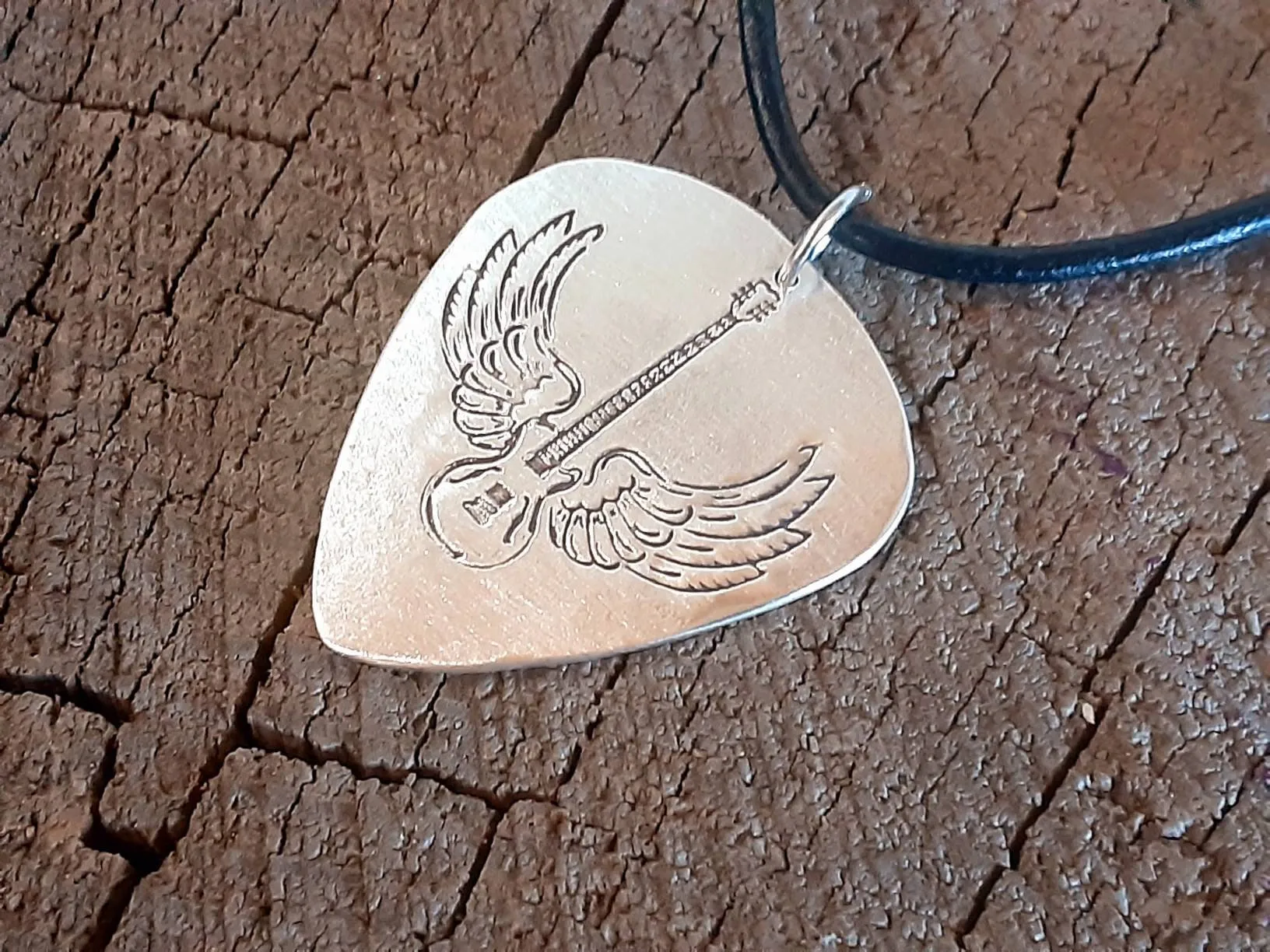 Sterling Silver winged guitar on guitar pick necklace
